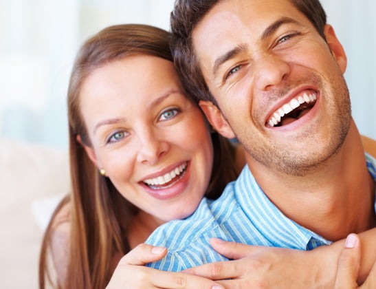 happy couple with healthy teeth