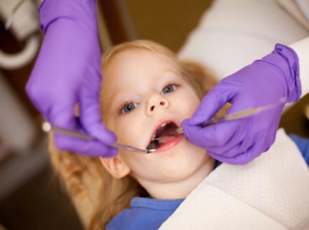 Child taking Dental Services from Deeragun Dental