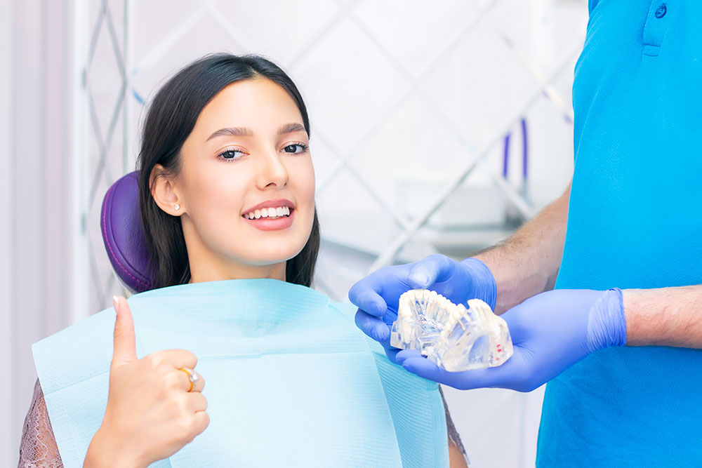 Teeth whitening in Townsville: A women getting teeth whitening treatment in Deeragun Dental